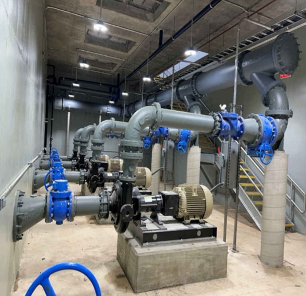 Pump station featuring blue and silver steel pumps.